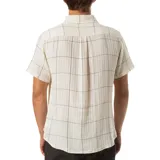Camisa de manga corta color beige con diseño a cuadros negros, cuello clásico y bolsillo en el pecho.