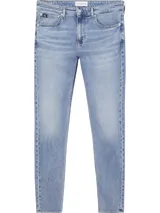 Jeans de tiro medio, corte slim tapered, color celeste claro, confeccionados en denim de algodón elástico.
