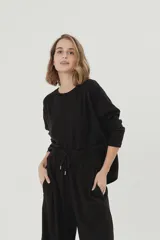 Buzo negro premium de morley suavizado térmico, de silueta amplia.