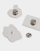 Set de tres pines metálicos esmaltados con diseño de elementos representativos de Tokyo: gato de la suerte, plato de ramen y estampilla con pagoda.