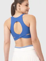 Top deportivo negro con breteles cruzados en la espalda y logo estampado en el frente.