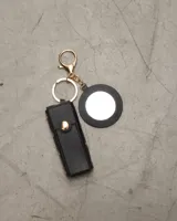 Llavero de alta calidad negro con espejo y diseño exclusivo, ideal para agregar estilo a tus accesorios.