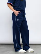 Pantalón de jogging azul con el escudo del Club Nacional de Football y el logo de Umbro.