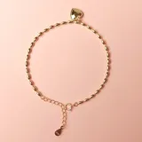Pulsera de plata 925 con cuentas ovaladas y dije en forma de corazón.