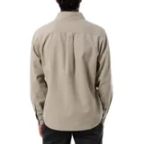 Camisa de pana color beige, de corte recto, manga larga y cuello clásico.