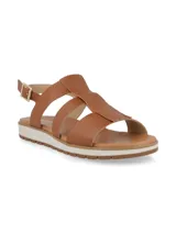 Sandalias bajas color marrón con tiras de cuero y suela blanca.