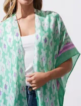 Kimono tejido color naranja con estampado abstracto en blanco y celeste, con terminación de ruedo con borlas.