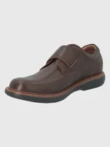 Zapato de cuero negro con ajuste de velcro, suela de goma EVA y plantilla de cuero y algodón orgánico.