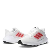Championes Adidas Ultra Bounce para mujer, color blanco con detalles en rosa y suela negra. Zapatillas de running con capellada de malla transpirable y las tres tiras características de la marca en los laterales.