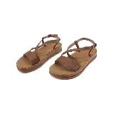 Sandalias marrones de cuero sintético con plataforma de corcho, tiras cruzadas y hebilla ajustable.