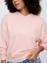 Buzo deportivo celeste con logo de la marca Gap en color blanco con diseño floral.