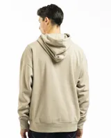 Buzo canguro verde con capucha y bolsillo frontal, de corte oversized.