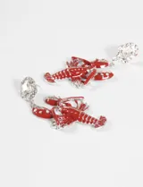 Caravanas colgantes con forma de langosta esmaltada en rojo brillante, con detalles plateados y engarce superior con cristal transparente de talla cuadrada.