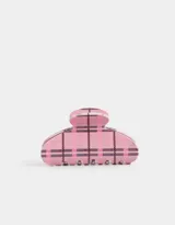 Broche para el pelo tipo pinza, de acrílico color rosa con diseño cuadrillé en tonos rosa y negro.