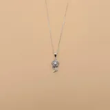 Conjunto de collar y dije de flor en plata 925 con circonias.