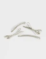 Set de cuatro horquillas plateadas para el pelo, dos con forma de moño y dos con apliques de strass.