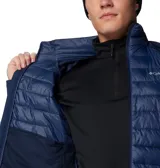 Chaqueta híbrida Columbia para hombre, color azul marino, con cuerpo acolchado y mangas de softshell. Presenta cierre frontal completo, cuello alto y logo de Columbia en el pecho.