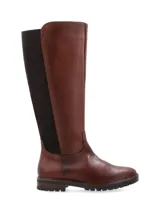 Bota de cuero marrón con elásticos laterales, caña alta y suela track.