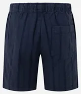 Bermuda de playa recta color mostaza, con textura de rayas y lazo en la cintura.