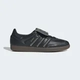Championes Adidas Samba LT de cuero negro con las tres tiras laterales en blanco y suela de goma color caramelo.