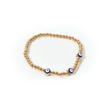 Pulsera de bijou con mostacillas doradas y detalles de ojo turco.
