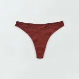 Pack de tres tangas de algodón de canalé fino en color blanco, rosa y marrón.
