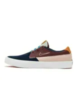 Championes de skate Nike SB Shane color azul marino, con detalles en marrón, beige y celeste.