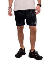 Short de baño azul con cintura elastizada, cordón de ajuste y logo de triángulo amarillo en la pierna derecha.