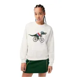Buzo blanco de algodón con cuello redondo, puños y cintura acanalados. Estampado frontal con el logo de Lacoste y un cocodrilo vestido con ropa de ciclista andando en bicicleta.