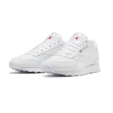 Championes Reebok Classic Leather blancos, de estilo casual y deportivo, con detalles en rojo y azul.