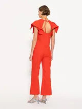 Pantalón negro de corte cropped y acampanado, confeccionado en tejido 4way.