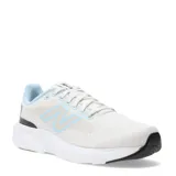Championes de running New Balance modelo 413 para mujer, color blanco jaspeado con detalles en celeste claro en el forro interior y el logo 'N' lateral. Poseen una suela gruesa blanca y detalles en negro en la puntera y talón.