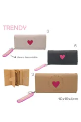 Billetera negra con detalle de corazón rosa y llavero con la palabra "Trendy" en rosa y amarillo.