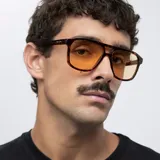 Gafas de sol con montura aviador carey y lentes amarillas.