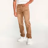 Pantalón de jean color verde militar, de corte slim, con cinco bolsillos y logo CAT en la parte trasera.