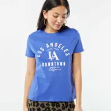 Remera azul con estampado blanco que dice 'Los Angeles Since 1990 LA Downtown American Club California'.