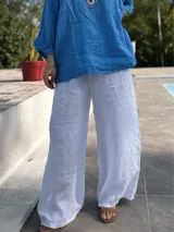 Pantalón palazzo blanco de lino, con cintura elástica.