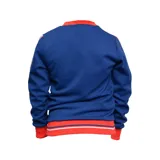 Buzo azul con cuello y puños rojos, con el escudo del Club Nacional de Football en el pecho y franjas rojas y blancas en las mangas.