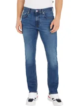 Pantalón de jean azul con efecto desgastado, corte recto y tiro medio.