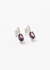 Caravanas colgantes de plata 925 con zirconia oval en color violeta.