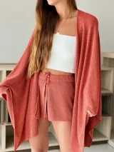 Short de punto color ladrillo con lurex y cordones ajustables.