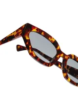 Gafas de sol unisex con montura de carey y lentes grises.