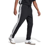 Pantalón deportivo Adidas negro con tres rayas blancas a los costados y logo blanco en el muslo.