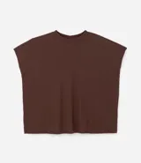 Blusa tipo muscle tee color turquesa, hecha en ribana de viscosa y poliéster, con escote redondo y sin sisas.