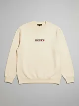 Sweater azul con logo de la marca Rusty bordado en el pecho.