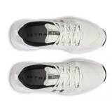 Championes Under Armour Charged Commit TR 4, color gris claro con logo negro y suela blanca.