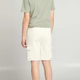 Short de chándal color blanco hueso con bolsillos laterales tipo cargo.