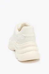 Zapatillas deportivas color crema con suela chunky y plataforma irregular de 5 cm.