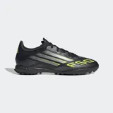 Championes de fútbol Adidas F50 League para césped artificial, color negro con detalles en amarillo y plateado. Presentan exterior Fiberskin con estampado Sprintgrid y lengüeta Tunnel adaptable.
