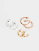 Set de aros argollas de metal en tres tamaños y colores: dorado, plateado y cobre.